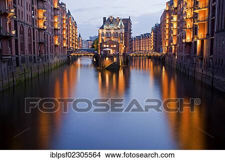 "Illuminated Wasserschloss castle between Hollaendischerbrookfleet channel and Wandrahmsfleet channel, Speicherstadt district, Free and Hanseatic City of Hamburg, Germany, Europe" View Large Photo Image Picture - "Illuminated Wasserschloss castle between Hollaendischerbrookfleet channel and Wandrahmsfleet channel, Speicherstadt district, Free and Hanseatic City of Hamburg, Germany, Europe". Fotosearch
