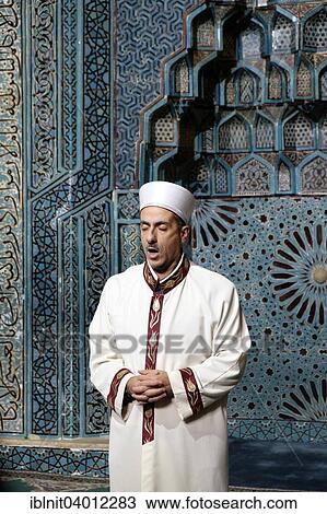 Stock Image - "Imam, Esrefoglu Mosque, Beysehir, Konya Province, Turkey, Asia". Fotosearch