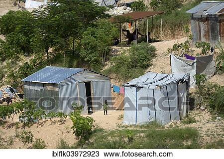 "Improvised huts in the new emerging slum area of Canaan outside the capital Port-au-Prince, Haiti, North America" View Large Photo Image Stock Image - "Improvised huts in the new emerging slum area of Canaan outside the capital Port-au-Prince, Haiti, North America". Fotosearch
