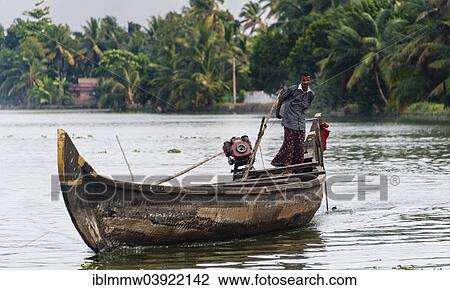 "Indian man steering a boat, Backwaters, Alappuzha District, Alleppey, Kerala, India, Asia" View Large Photo Image Stock Image - "Indian man steering a boat, Backwaters, Alappuzha District, Alleppey, Kerala, India, Asia". Fotosearch