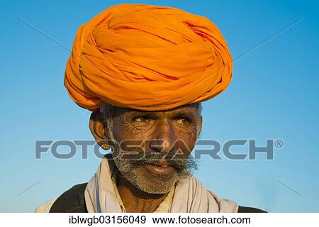 "Indian man with an orange turban, portrait, Pushkar, Rajasthan, India, Asia" View Large Photo Image Stock Photo - "Indian man with an orange turban, portrait, Pushkar, Rajasthan, India, Asia". Fotosearch