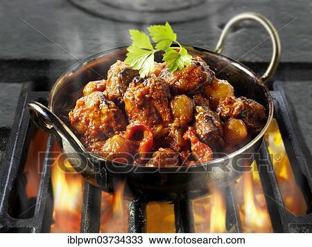 Indian Piri Piri chicken curry being cooked over hot charcoals View Large Photo Image Stock Image - Indian Piri Piri chicken curry being cooked over hot charcoals. Fotosearch