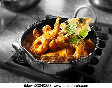 Stock Image - Indian prawn Makhani curry. Fotosearch