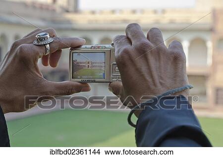 "Indian tourist taking a photograph at Agra Fort, Agra, India, Asia" View Large Photo Image Picture - "Indian tourist taking a photograph at Agra Fort, Agra, India, Asia". Fotosearch