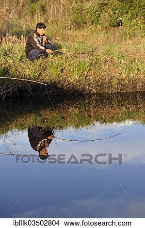 "Indigenous man fishing in a pond in the community of Mbya-Guarani Indians, Campito, Caaguazu Department, Paraguay, South America" View Large Photo Image Picture - "Indigenous man fishing in a pond in the community of Mbya-Guarani Indians, Campito, Caaguazu Department, Paraguay, South America". Fotosearch