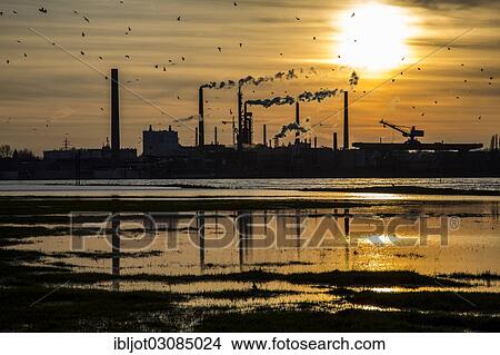 "Industrial plant of Sachtleben Chemie GmbH, a manufacturer of specialty chemicals, on the Rhine River at sunset, Homberg, Duisburg, North Rhine-Westphalia, Germany, Europe" View Large Photo Image Picture - "Industrial plant of Sachtleben Chemie GmbH, a manufacturer of specialty chemicals, on the Rhine River at sunset, Homberg, Duisburg, North Rhine-Westphalia, Germany, Europe". Fotosearch
