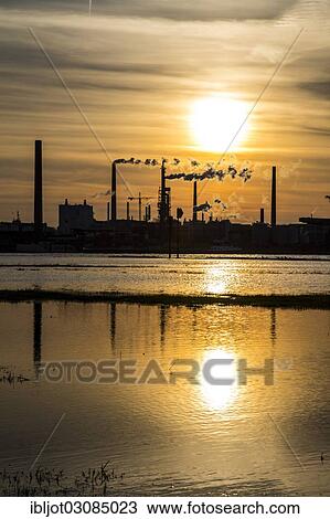 "Industrial plant of Sachtleben Chemie GmbH, a manufacturer of specialty chemicals, on the Rhine River at sunset, Homberg, Duisburg, North Rhine-Westphalia, Germany, Europe" View Large Photo Image Stock Image - "Industrial plant of Sachtleben Chemie GmbH, a manufacturer of specialty chemicals, on the Rhine River at sunset, Homberg, Duisburg, North Rhine-Westphalia, Germany, Europe". Fotosearch