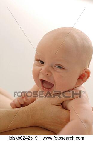 Infant being held View Large Photo Image Stock Image - Infant being held. Fotosearch