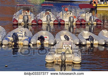 Stock Photo - "Inflatable boats with outboard motors in the harbor of Porto, Guaita, Porto, Corsica, France, Europe". Fotosearch
