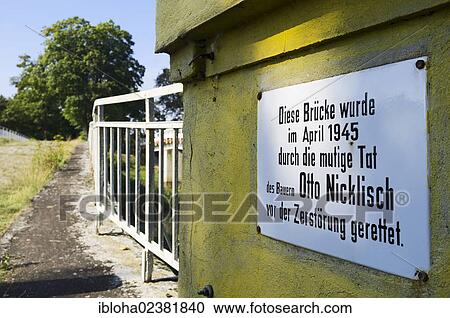 Stock Image - "Information board on a bridge crossing the Schwarze Elster River near Neudeck, Elbe-Elster, Brandenburg, Germany, Europe". Fotosearch