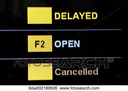 Stock Photograph - "Information board showing the departure times at an airport, delayed, open, cancelled". Fotosearch