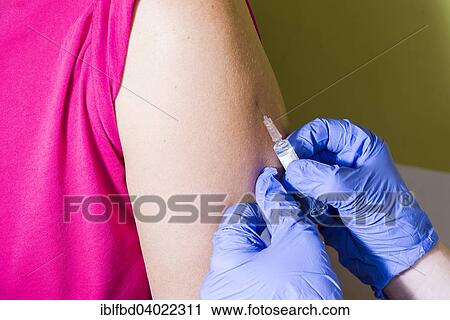 "Injection of medicine into an arm, Berlin, Germany, Europe" View Large Photo Image Stock Image - "Injection of medicine into an arm, Berlin, Germany, Europe". Fotosearch