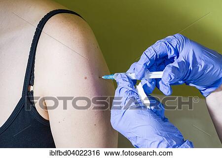 "Injection of medicine into an arm, Berlin, Germany, Europe" View Large Photo Image Stock Photograph - "Injection of medicine into an arm, Berlin, Germany, Europe". Fotosearch