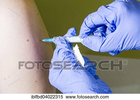 "Injection of medicine into an arm, Berlin, Germany, Europe" View Large Photo Image Stock Photography - "Injection of medicine into an arm, Berlin, Germany, Europe". Fotosearch