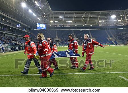 "Injured football player being carried off the field by attendants from the Red Cross, Rhein-Neckar Arena, Sinsheim, Baden-Wurttemberg, Germany, Europe" View Large Photo Image Stock Photo - "Injured football player being carried off the field by attendants from the Red Cross, Rhein-Neckar Arena, Sinsheim, Baden-Wurttemberg, Germany, Europe". Fotosearch
