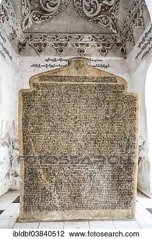 Stock Image - "Inscription, Pali Canon or Tripitaka, a buddhist canon, Atthakatha-stone tablets, Sandamuni Pagoda, Mandalay, Mandalay Region, Myanmar, Asia". Fotosearch