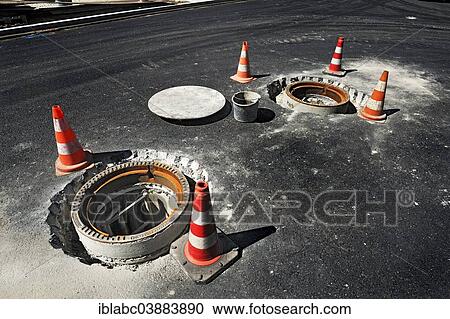 "Installation of two manhole covers, Obersendling, Munich, Upper Bavaria, Bavaria, Germany, Europe" View Large Photo Image Stock Image - "Installation of two manhole covers, Obersendling, Munich, Upper Bavaria, Bavaria, Germany, Europe". Fotosearch