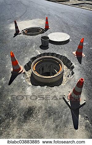 "Installation of two manhole covers, Obersendling, Munich, Upper Bavaria, Bavaria, Germany, Europe" View Large Photo Image Stock Photography - "Installation of two manhole covers, Obersendling, Munich, Upper Bavaria, Bavaria, Germany, Europe". Fotosearch