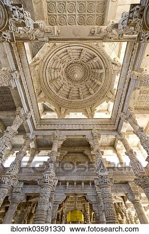 Stock Image - "Interior hall with ornate pillars and ceilings in the marble temple, Adinatha Temple, temple of the Jain religion, Ranakpur, Rajasthan, India, Asia". Fotosearch