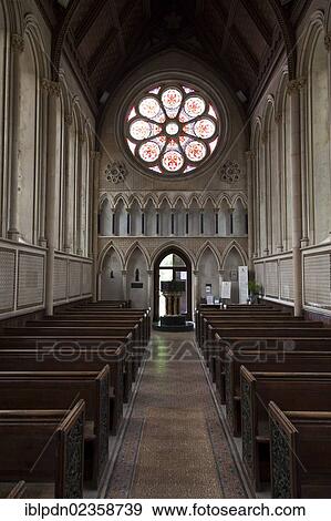 "Interior of The church of Saint Mary at Itchen Stoke with stained glass rose window and font, Itchen Stoke, Hampshire, England, United Kingdom, Europe" View Large Photo Image Stock Photo - "Interior of The church of Saint Mary at Itchen Stoke with stained glass rose window and font, Itchen Stoke, Hampshire, England, United Kingdom, Europe". Fotosearch