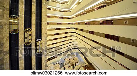 Stock Photograph - "Interior view, lobby and lifts at the Sheraton Doha Hotel, Doha, Doha, Qatar, Asia". Fotosearch