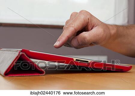 iPad tablet computer in red cover case View Large Photo Image Stock Photograph - iPad tablet computer in red cover case. Fotosearch
