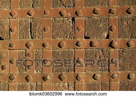 Stock Photograph - "Iron mountings and hand-forged nails on an old door, Mehrangarh Fort, Jodhpur, Rajasthan, India, Asia". Fotosearch