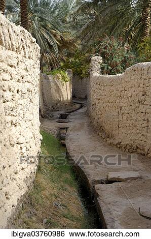 "Irrigation canal in a lane, oasis city of Ghadames, UNESCO world heritage, Ghadames, Libya, Africa" View Large Photo Image Stock Photograph - "Irrigation canal in a lane, oasis city of Ghadames, UNESCO world heritage, Ghadames, Libya, Africa". Fotosearch