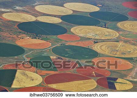 "Irrigation of large areas in the Karoo desert, round fields in different growth stadiums, Karoo, South Africa, Africa" View Large Photo Image Stock Photo - "Irrigation of large areas in the Karoo desert, round fields in different growth stadiums, Karoo, South Africa, Africa". Fotosearch