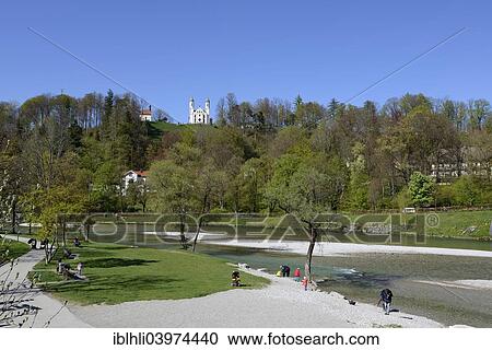 Stock Image - "Isar promenade, embankment of the Isar River Leonard Chapel and the Church of the Holy Cross, Calvary, Bad Tolz, Upper Bavaria, Bavaria, Germany, Europe". Fotosearch