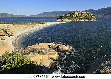 Stock Image - "Island with castle on the north shore of Bafa Lake Nature Park, Heracleia by Latmus, Kapikiri, Mugla Province, Turkey, Asia". Fotosearch