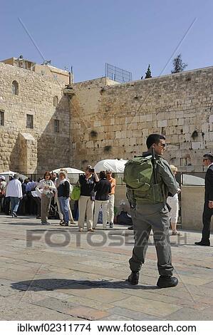 "Israeli soldier with a machine gun guarding the tourists at the Wailing Wall or Western Wall, Muslim Quarter, Old City, Jerusalem, Israel, Middle East, Southwest Asia, Asia" View Large Photo Image Picture - "Israeli soldier with a machine gun guarding the tourists at the Wailing Wall or Western Wall, Muslim Quarter, Old City, Jerusalem, Israel, Middle East, Southwest Asia, Asia". Fotosearch