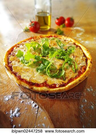 Stock Photo - Italian cheese pizza with rocket. Fotosearch