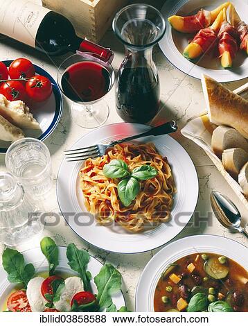 "Italian national cuisine, Tagliatelle with tomato sauce, Parmesan cheese, mozzarella cheese, minestrone soup, Parma ham with melon, red wine" View Large Photo Image Stock Photo - "Italian national cuisine, Tagliatelle with tomato sauce, Parmesan cheese, mozzarella cheese, minestrone soup, Parma ham with melon, red wine". Fotosearch