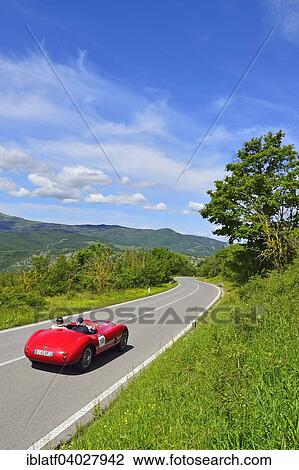"Jaguar Special, 1950, classic car, racing car, auto car race Mille Miglia, 1000 Miglia, on road through hilly landscape with mountain Biondetti, near Radicofani, Tuscany, Italy, Europe" View Large Photo Image Stock Image - "Jaguar Special, 1950, classic car, racing car, auto car race Mille Miglia, 1000 Miglia, on road through hilly landscape with mountain Biondetti, near Radicofani, Tuscany, Italy, Europe". Fotosearch