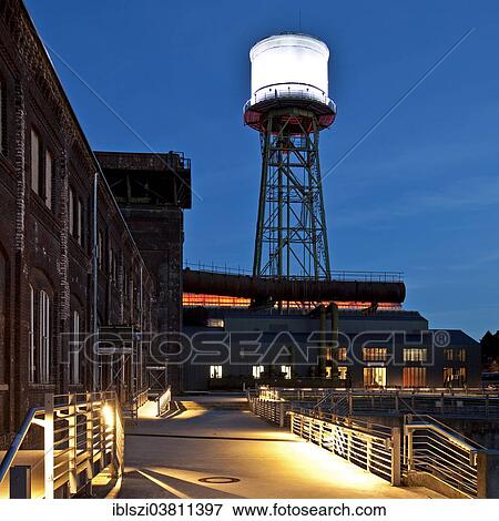 "Jahrhunderthalle or Centennial Hall with a water tower at dusk, Bochum, North Rhine-Westphalia, Germany, Europe" View Large Photo Image Stock Photo - "Jahrhunderthalle or Centennial Hall with a water tower at dusk, Bochum, North Rhine-Westphalia, Germany, Europe". Fotosearch