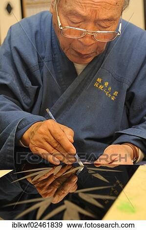 "Japanese artisan scraping the top lacquer coat away to carve out golden bamboo leaves, Sabae, Fukui, Japan, East Asia, Asia" View Large Photo Image Stock Photo - "Japanese artisan scraping the top lacquer coat away to carve out golden bamboo leaves, Sabae, Fukui, Japan, East Asia, Asia". Fotosearch