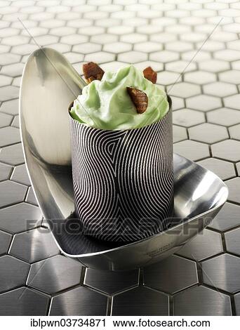 Stock Image - Japanese cake with a pattered chocolate case and mint cream. Fotosearch