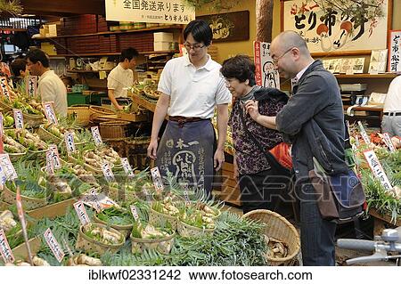 "Japanese couple shopping at a gourmet food store offering bamboo shoots and mushrooms, including matsutake, pine mushrooms (Tricholoma matsutake), very expensive mushrooms, Teramachi-Dori shopping street, Kyoto, Japan, East Asia, Asia" View Large Photo Image Stock Image - "Japanese couple shopping at a gourmet food store offering bamboo shoots and mushrooms, including matsutake, pine mushrooms (Tricholoma matsutake), very expensive mushrooms, Teramachi-Dori shopping street, Kyoto, Japan, East Asia, Asia". Fotosearch