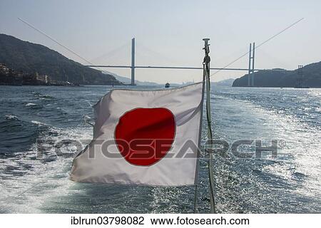 Stock Image - "Japanese flag, Megami Bridge at the back, Nagasaki, Japan, Asia". Fotosearch