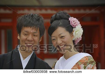 "Japanese man and a Japanese woman wearing a kimono for spring with a kimono collar and an updo hairstyle with chrysanthemums, Shimogamo Schrein, Kyoto, Kinki region, Japan, Asia" View Large Photo Image Stock Photo - "Japanese man and a Japanese woman wearing a kimono for spring with a kimono collar and an updo hairstyle with chrysanthemums, Shimogamo Schrein, Kyoto, Kinki region, Japan, Asia". Fotosearch