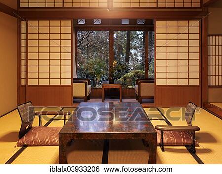 Japanese Tea Table Chabudai And Zaisu Chairs At Ryokan Room With