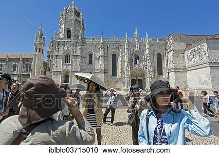 Stock Image - "Japanese tourists in front of the Mosteiro dos Jeronimos, Jeronimos Monastery, UNESCO World Cultural Heritage Site, Belem, Lisbon, Lisbon District, Portugal, Europe". Fotosearch
