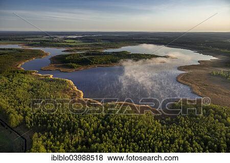"Jathensee Lake at Sunrise with mist, Roggentin, Mecklenburg Lake District, Mecklenburg-Western Pomerania, Germany, Europe" View Large Photo Image Stock Photo - "Jathensee Lake at Sunrise with mist, Roggentin, Mecklenburg Lake District, Mecklenburg-Western Pomerania, Germany, Europe". Fotosearch