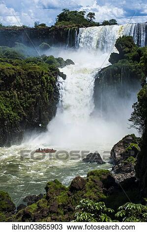 Stock Image - "Jetboat underneath the Iguazu Falls, Iguazu National Park, UNESCO World Heritage Site, Argentina, South America". Fotosearch