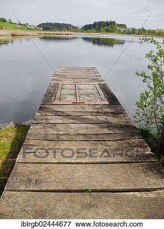"Jetty at Kreuzweiher pond in Tannau, Baden-Wuerttemberg, Germany, Europe" View Large Photo Image Stock Photo - "Jetty at Kreuzweiher pond in Tannau, Baden-Wuerttemberg, Germany, Europe". Fotosearch