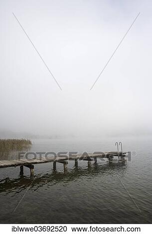 Stock Image - "Jetty, fog, Irrsee lake, Salzkammergut, Austria, Europe". Fotosearch