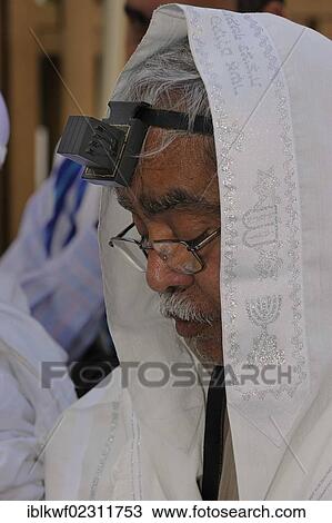 "Jew with a tefillin on his head and prayer shawl, tallit, around the head, Muslim Quarter, Jerusalem, Israel, Middle East, Southwest Asia, Asia" View Large Photo Image Stock Image - "Jew with a tefillin on his head and prayer shawl, tallit, around the head, Muslim Quarter, Jerusalem, Israel, Middle East, Southwest Asia, Asia". Fotosearch