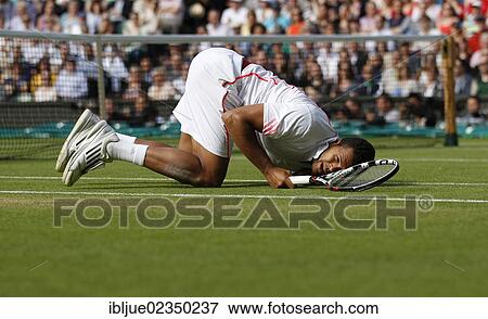 "Jo-Wilfried Tsonga, FRA, fallen down and lying on the lawn, men's semi-final, Wimbledon Championships 2012 AELTC, ITF Grand Slam Tennis Tournament, London, England, United Kingdom, Europe" View Large Photo Image Stock Photo - "Jo-Wilfried Tsonga, FRA, fallen down and lying on the lawn, men's semi-final, Wimbledon Championships 2012 AELTC, ITF Grand Slam Tennis Tournament, London, England, United Kingdom, Europe". Fotosearch