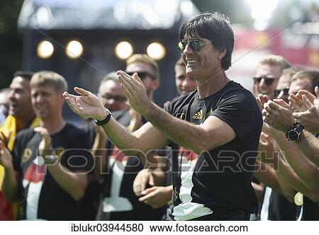 Stock Image - "Joachim Low celebrates with fans, reception of the German national team after their victory at the FIFA World Cup 2014, fan party at the Brandenburg Gate, Berlin, Germany, Europe". Fotosearch